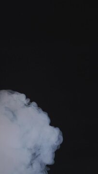Stream of smoke on a black background slow motion