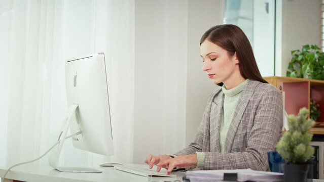 Slow motion shot of successful businesswoman hands typing on computer keyboard working from home, remotely work