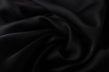Luxury texture of black silk or satin texture , close up