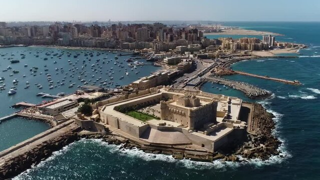 Aerial of the Citadel of Qaitbay, a 15th-century defensive fortress perched on the Mediterranean coast in Alexandria, Egypt, the concept of historical resilience and maritime protection.