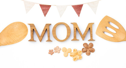 Mom wood texture letter with paper flower and wooden ladle with bunting flag isolate on white background, Mother's day card concept background idea