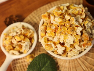 Popcorn for a plate and a cup of dipping sauce