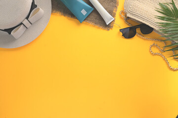 Top view traveler accessories on yellow background. Summer and travel vacation concept