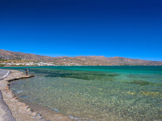 Coast of clear water (Elounda, Crete, Greece) - obrazy, fototapety, plakaty
