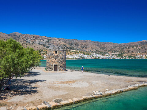 Ruin of old windmills in the coast (Elounda, Crete, Greece)