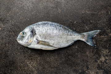 Fresh sea bream fish on kitchen table. Top view. - 791403932