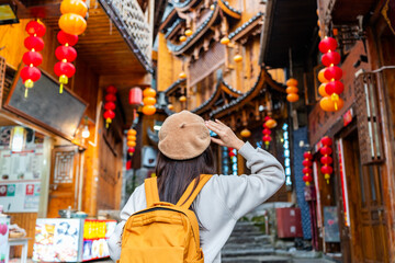 Young female tourist walking at Furong old Town, The famous tourist destination at Hunan Province, China - 791403950
