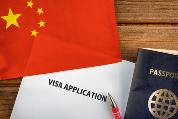 Visa application form, passport and flag of China