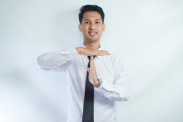 Businessman showing hand sign ,pause or request a break ,time out gesture sign ,time for a break...