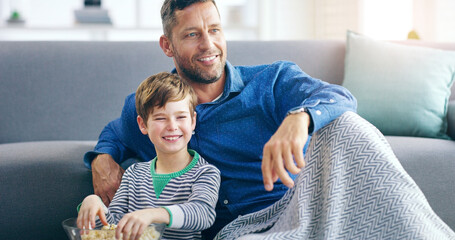 Relax, dad and son watching tv on sofa in home with popcorn, online video or streaming movie...
