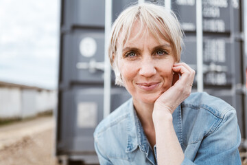Captivating Confidence: Serene Portrait of a Stylish Short-Haired Blonde Woman Embracing Positivity by the Lake Container - 791413764