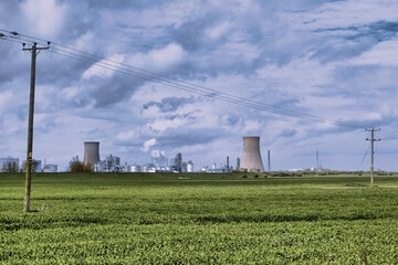 Fototapeta na wymiar HDR Oil refinery, cooling towers, with smoke.