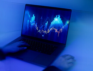 Businesswoman analysing economic growth graph financial data on laptop. Stock market investment. Financial and banking Technology. Business strategy and digital marketing concept.	
