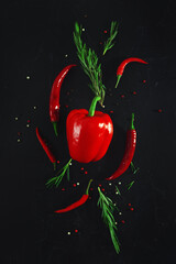 Mix of peppers on a black background.