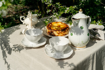 Directly above view of basque burnt cheesecake and cups for coffee. 