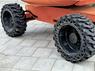 chassis with rubber wheels with rough tires. damage the pavement and make spots and smears of black...