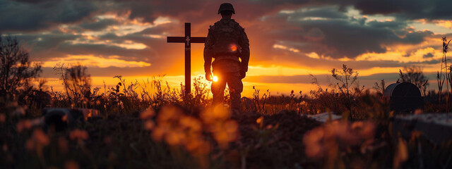 Sad military soldier army respect remembrance standing at memorial cemetery grave victim loss hero dead death die fallen in war battle silhouette sunset background - obrazy, fototapety, plakaty