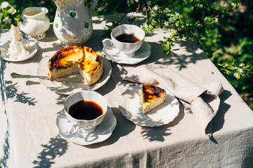 Outdoor summer breakfast with cheesecake and coffee. Aesthetic breakfast with food and drinks