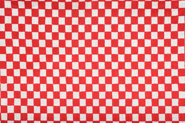 Red and white checkered tablecloth. Textured background. Picnic tablecloth.