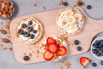 Rice Crackers Healthy Snack, Crackers Topped with Banana, Fresh Berries, Yogurt and Granola, Breakfast Idea
