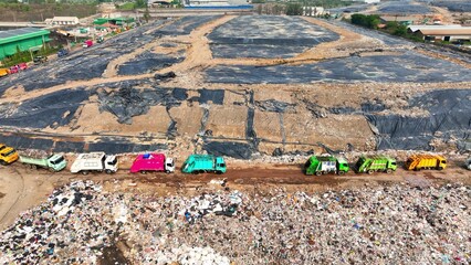 Hovering high, the landfill is obscured by swathes of black plastic, a stark reminder of our...