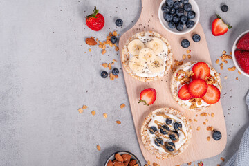 Rice Crackers Healthy Snack, Crackers Topped with Banana, Fresh Berries, Yogurt and Granola, Breakfast Idea