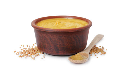 Fresh tasty mustard sauce in bowl, spoon and dry seeds isolated on white