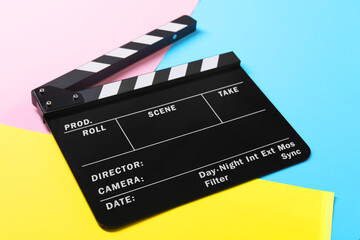 Fototapeta na wymiar Clapperboard on color background, closeup. Film industry