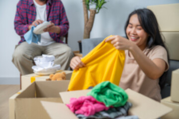 Image blur of couple is moving household items into their new home