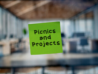 Post note on glass with 'Picnics and Projects'.