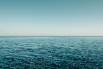 The vastness of the ocean stretching out to the horizon, with just the line where the sea meets the sky in the frame.