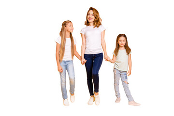 Obraz premium Full length body size view portrait of three nice cute winsome attractive slim cheerful people holding hands mum mommy isolated over bright vivid shine yellow background