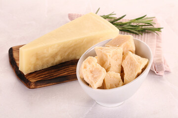 Chopped Italian hard parmesan cheese