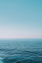 Fototapeta premium The vastness of the ocean stretching out to the horizon, with just the line where the sea meets the sky in the frame.