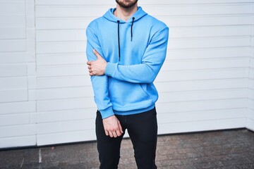Showcase your logo and brand swag with this mockup of a trendy man in a blue hoodie