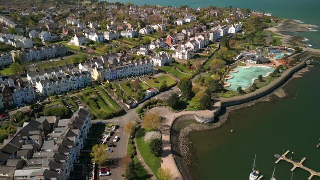 Overhead shot, beginning on the left hand side and moving to the right to reveal boats on a marina on a sunny day.

Filmed at Bangor Marina, NI in 4K, 60 frames per second and with Rec709 color space.