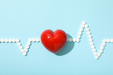 Heart with a cardiogram on a light background.
