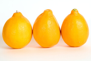 Group of Three Lemons Sitting Together