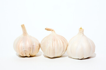 Three Garlic Cloves Positioned Together