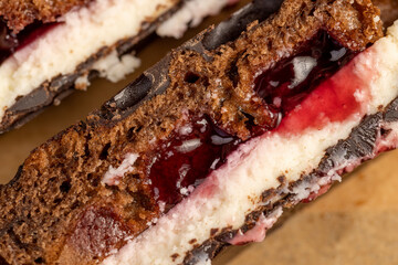 cottage cheese dessert with cherry jam covered with chocolate