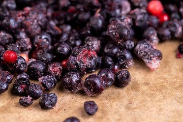 large number of frozen blueberries with red unripe