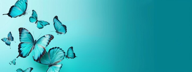 Elegant blue butterflies floating on a serene teal background