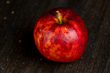 one ripe red apple in close-up