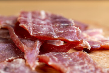 Obraz premium dried pork meat with spices and salt on the table