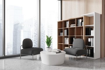 Office chill zone interior with two armchairs and shelf, panoramic window
