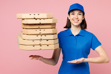 Delivery girl employee woman wear blue cap t-shirt uniform workwear work as dealer courier hold toss up pizza in paper blank craft cardboard flatbox isolated on plain pink background. Service concept. - 791453737