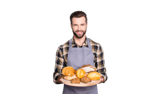 Portrait of friendly attractive baker in uniform with stubble having present showing tray with bakery products, looking at camera, isolated on grey background