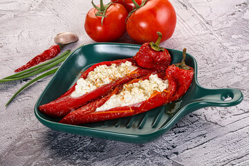 Baked red sweet ramiro pepper with curd