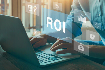 ROI Return On Investment concept on virtual screen, invest money, calculate profit