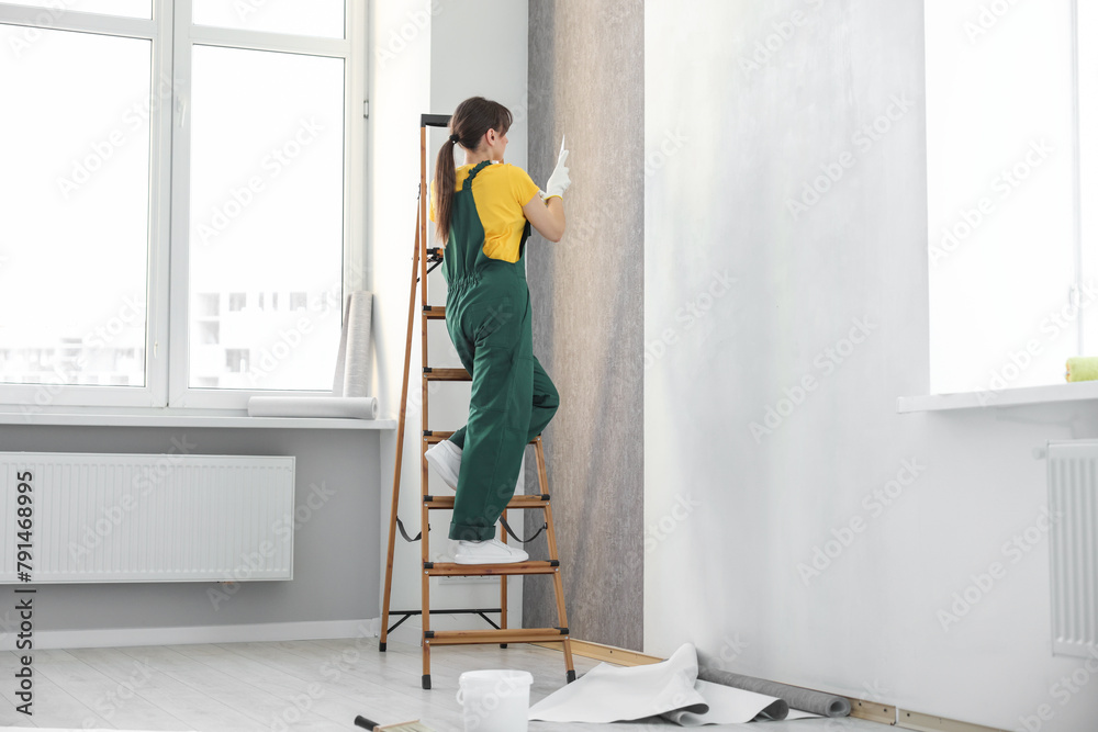 Sticker Woman hanging stylish gray wallpaper in room